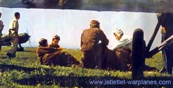 Group of pilot with trainer version of G.50 in background