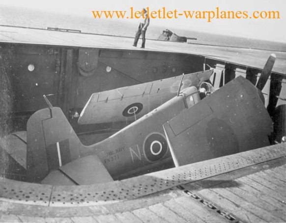 One of 252 Royal Navy Hellcat F.I on elevator aboard carrier, these fighters had reasonable success in Royal Navy’s fighter roll [Grumman]