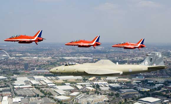 EE Canberra PR.9 XH134 with the RAF Red Arrows as part of the Queens flypast in 2006