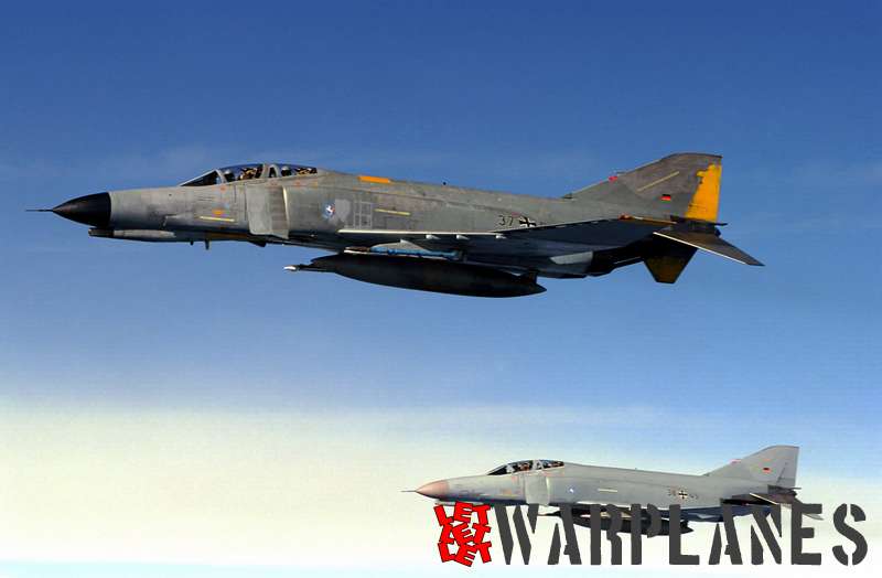 Two German Air Force F-4F Phantom aircraft fly in formation during a refueling mission near Royal Air Force (RAF) Mildenhall, United Kingdom (GRB).
